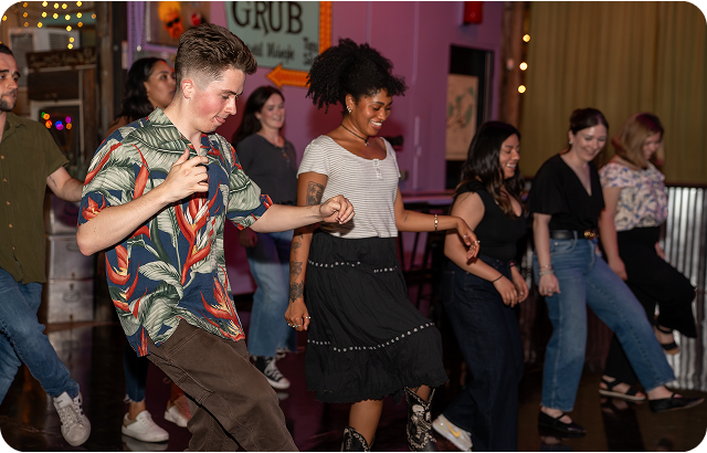 Picture of 4 poeple posing for a picture at the Proctorio user conference.