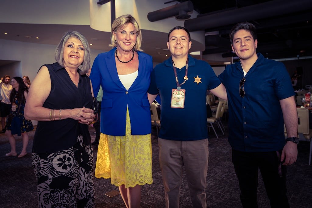 Picture of 4 poeple posing for a picture at the Proctorio user conference.